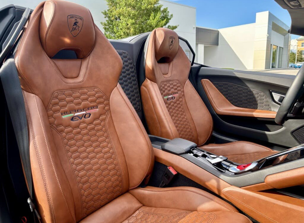 Luxury brown leather Lamborghini Huracan EVO car seats with detailed honeycomb stitching and embossed logo, premium sport interior seating.